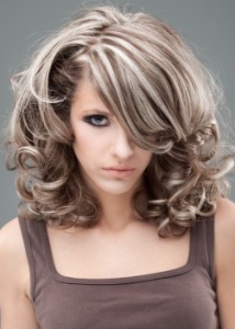 beauty portrait of blonde woman in 60s style make-up and hairstyle